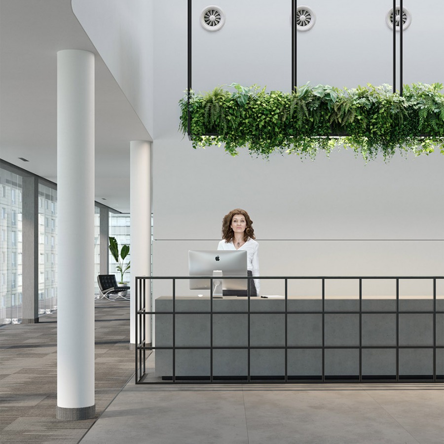 concrete info desk with a woman who works there
